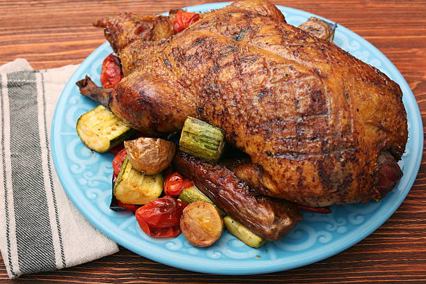istock Festive roast duck with vegetables 637550592