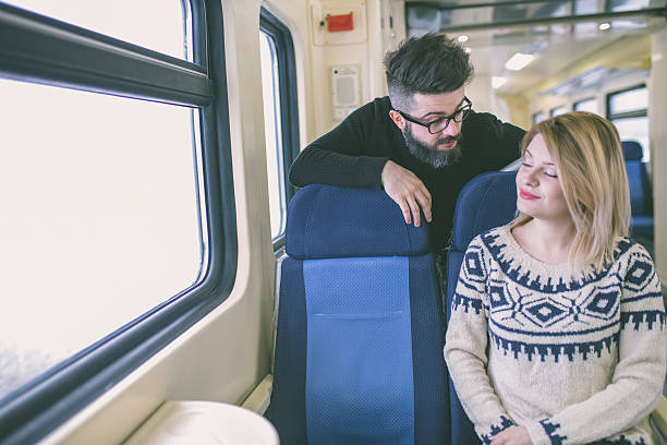 istock Happy couple traveling by train 637554498