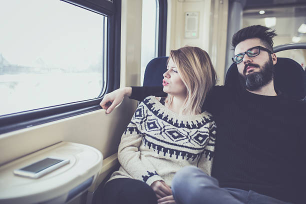 istock Happy couple traveling by train 637554910