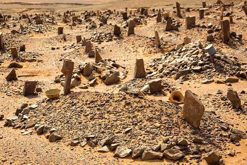 Berber old cemetery at abandoned mining village on edge of the Sahara desert in Morocco.