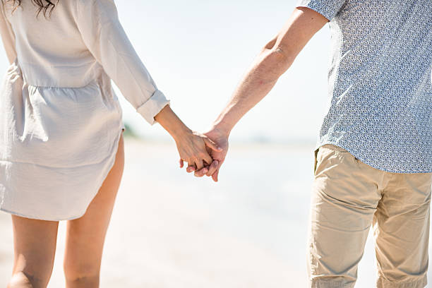 istock Happiness couple at the seaside walking on the beach 637555554