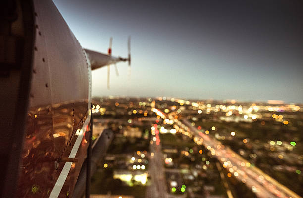 istock helicopter flying at dusk in miami 637557826
