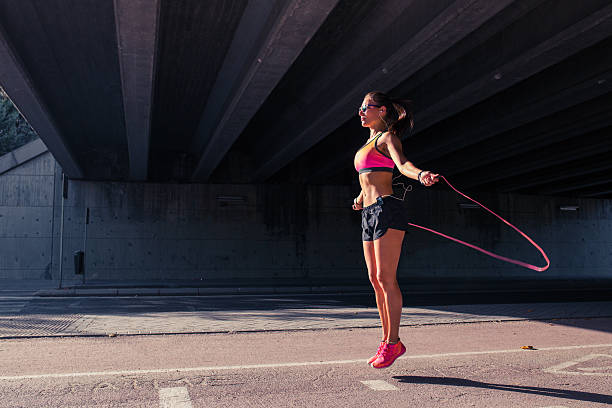 Fit woman runner warming up outdoors