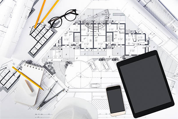 construction plans with tablet and drawing tools on blueprints - instrument of measurement organization housing project housing development imagens e fotografias de stock