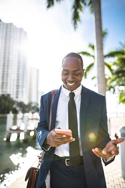 istock businessman texting in miami 637563080
