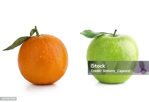Apple And Orange Difference Stock Photo - Download Image Now - Comparison, Orange - Fruit, Apple - Fruit