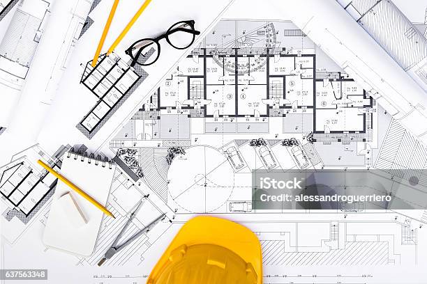 Construction Plans With Tablet Drawing And Working Tools On Blu Stock Photo - Download Image Now