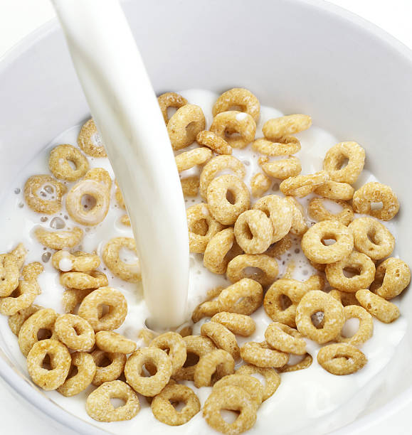 istock Cereal Bowl With Milk Pouring 637563680