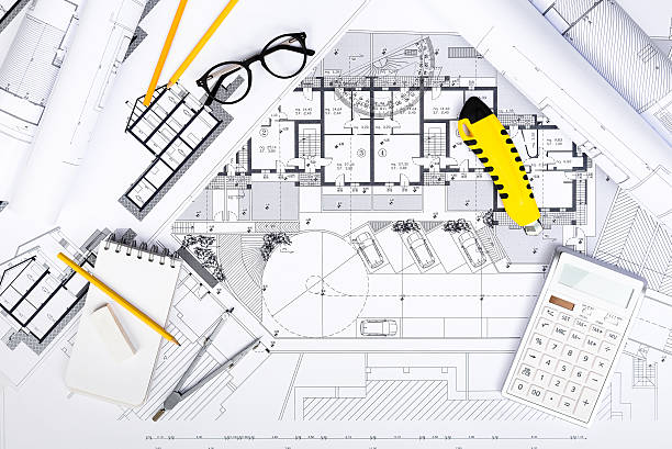 construction plans with drawing tools and calculatore on bluepri - instrument of measurement organization housing project housing development imagens e fotografias de stock