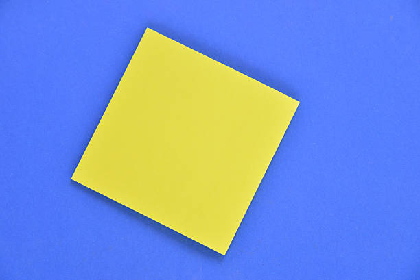 istock sheet of paper isolated on blue 637569284