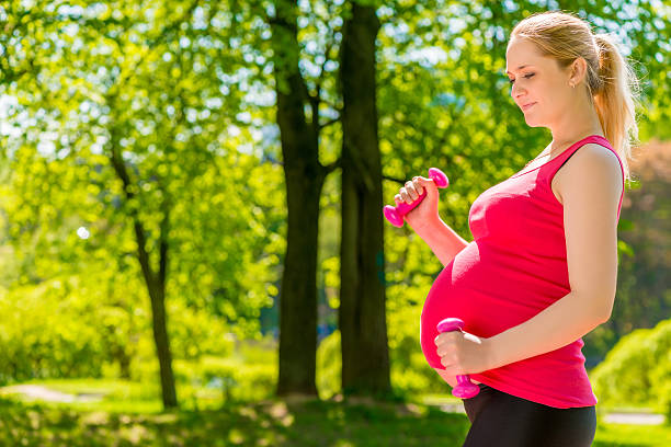 istock exercise with dumbbells outdoors useful for mom and child health 637569826