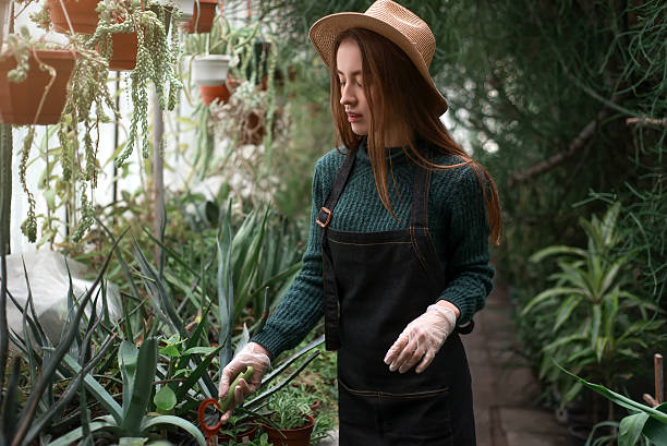 istock Female florist with shovel in hands 637571914