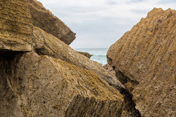 istock atlantic coastline with surfes in cloudy day 637572040