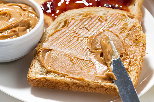 istock toast with peanut butter and jam for breakfast, closeup 637572094