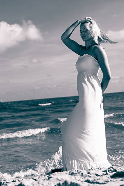 istock Beautiful woman on sunny beach. 637575394