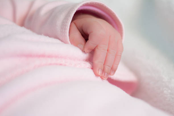 istock Newborn baby hand 637575770