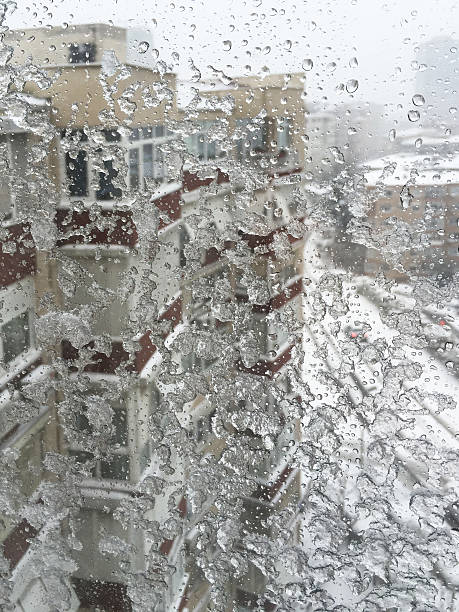 istock ice on window against street under snow 637577224