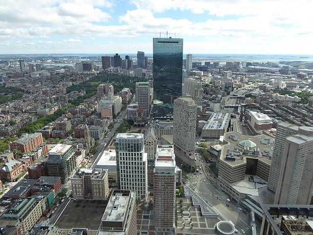 Boston skyline and John Hancock building from the Prudential Tower John Hancock building from the Prudential Tower. Cloudy sky with Ocean and islands in the distance. Boston skyline. boston prudential building stock pictures, royalty-free photos & images