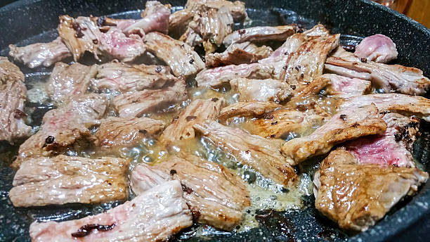 istock Strips of fillet steak being cooked 637577850