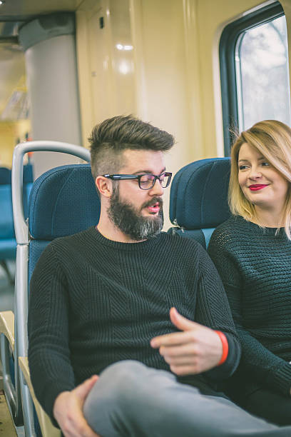 istock Young couple taking a ride on a train 637578028