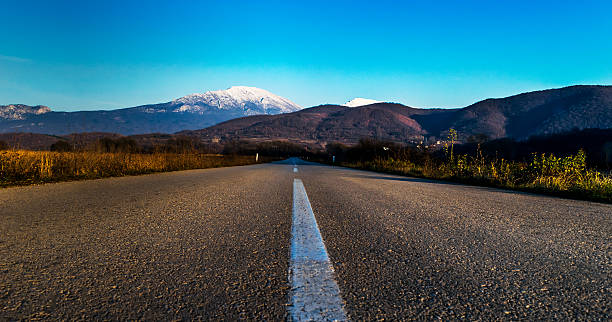istock Road leading to the mountains 637578846