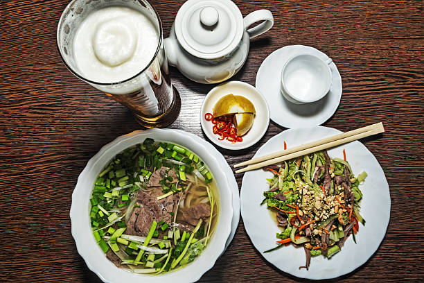 Traditional Vietnamese food with pho soup and mix salad