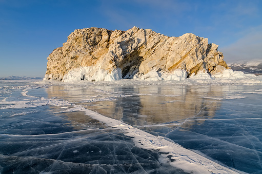 Smooth transparent ice with cracks,  lake Baikal. Russia