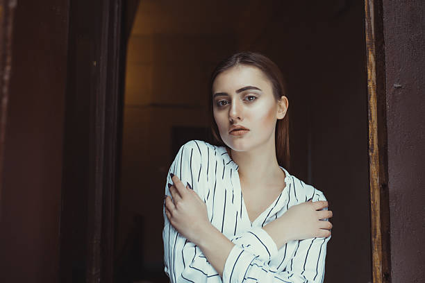 istock Lovely brunette model posing in the dark room 637581232