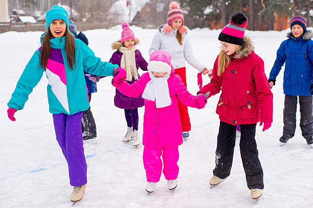 istock group of kids on the ice 637584754