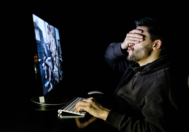 istock Handsome male gamer playing computer video game 637585378