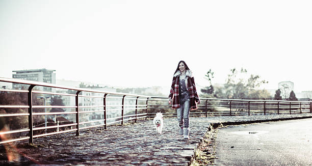 istock Girl and her pet taking a walk 637585498