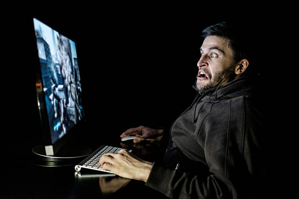 istock Handsome male gamer playing computer video game 637586092