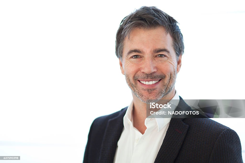 Portrait Of A Handsome man Isolated On white. Smiling Headshot Stock Photo