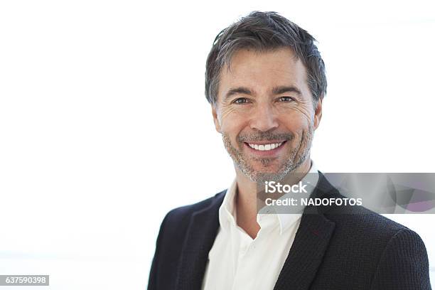 Portrait Of A Handsome Man Isolated On White Smiling Stock Photo - Download Image Now