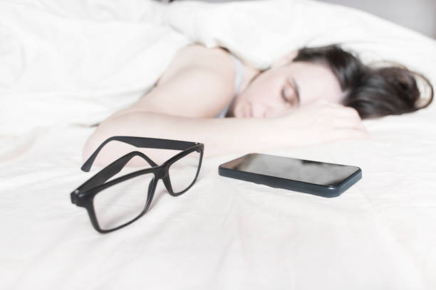 istock Tired young woman sleeping on bed 637595656