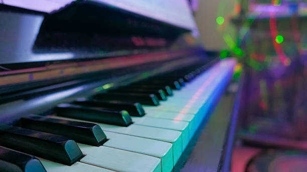 istock Selective focus on piano keys and laser lights. 637596580