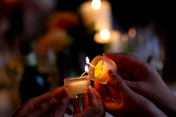 pass the fire of candles pass the fire of candles relay photos stock pictures, royalty-free photos & images
