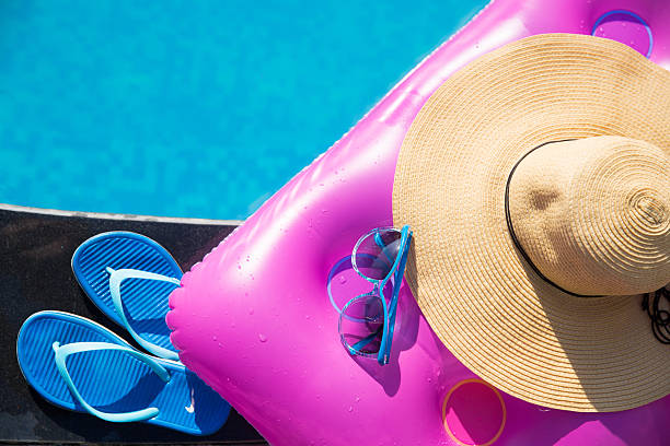 istock slippers, sunglasses, straw hat and air mattress 637597188