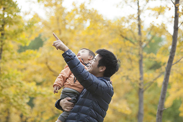 istock Happy real father and son pointing afar 637598604