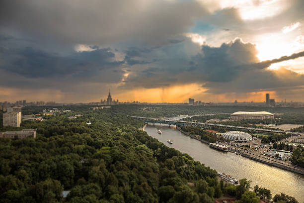 istock Tilt and shift view of rainy sunset clouds above Moscow 637599892
