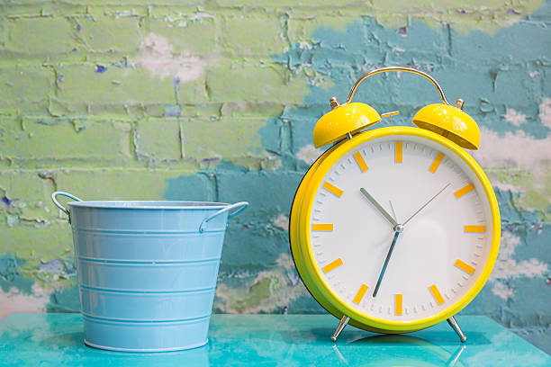 istock Big yellow retro style alarm clock 637602658