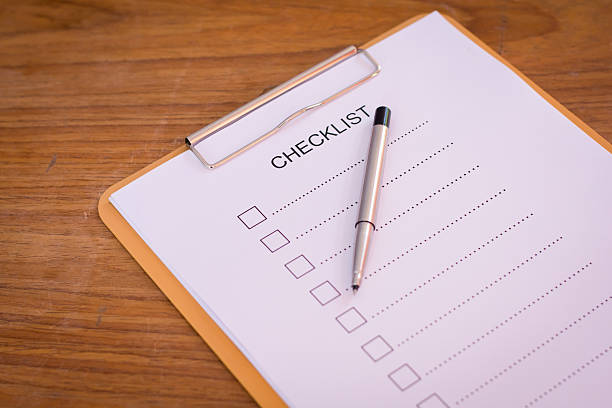istock Checklist concept - checklist, paper and a pen 637611290