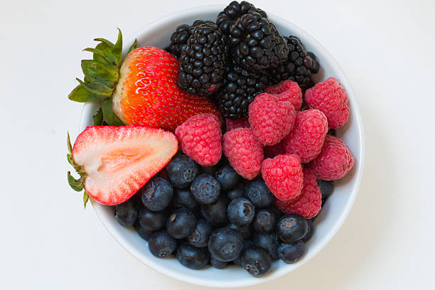 istock Organic fresh mixed fruit in a bowl on the table. 637611342