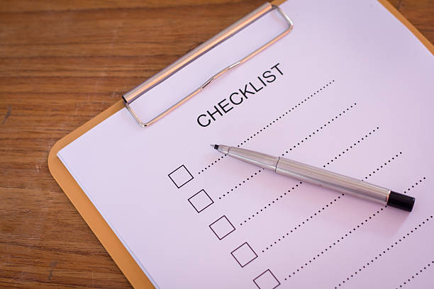 istock Checklist concept - checklist, paper and a pen 637611562