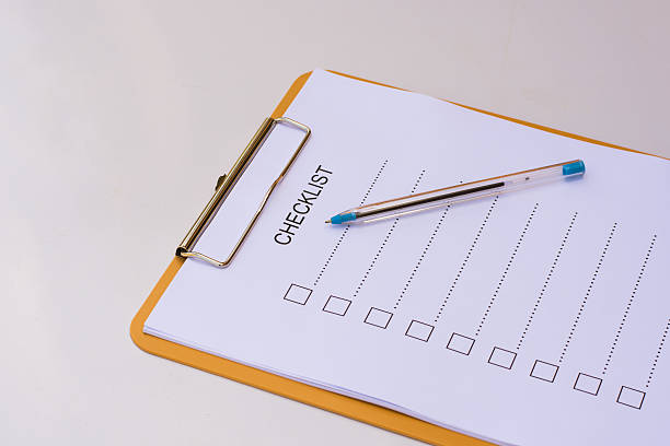 istock Checklist concept - checklist, paper and a pen 637612242