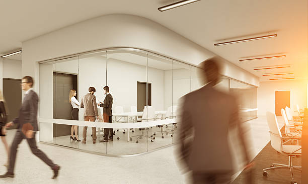 istock People walking in white office. Cityscape on the foreground, ton 637614762