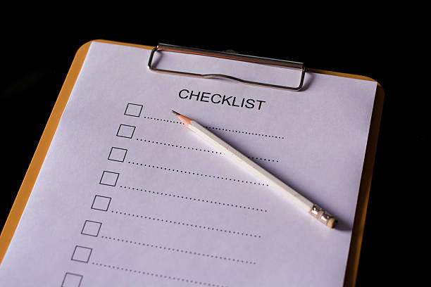 istock Checklist concept - checklist, paper and a pen 637614828