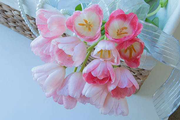 istock fresh pink tulips on wicker basket 637614898