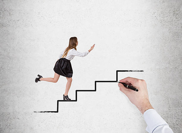 istock Woman running up stairs drawn on concrete wall 637615562