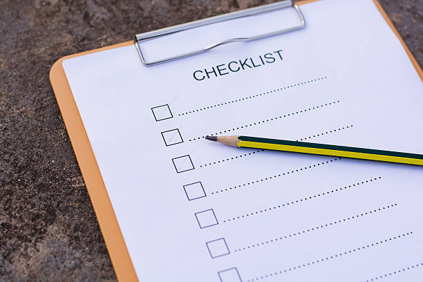 istock Checklist concept - checklist, paper and a pen 637615636